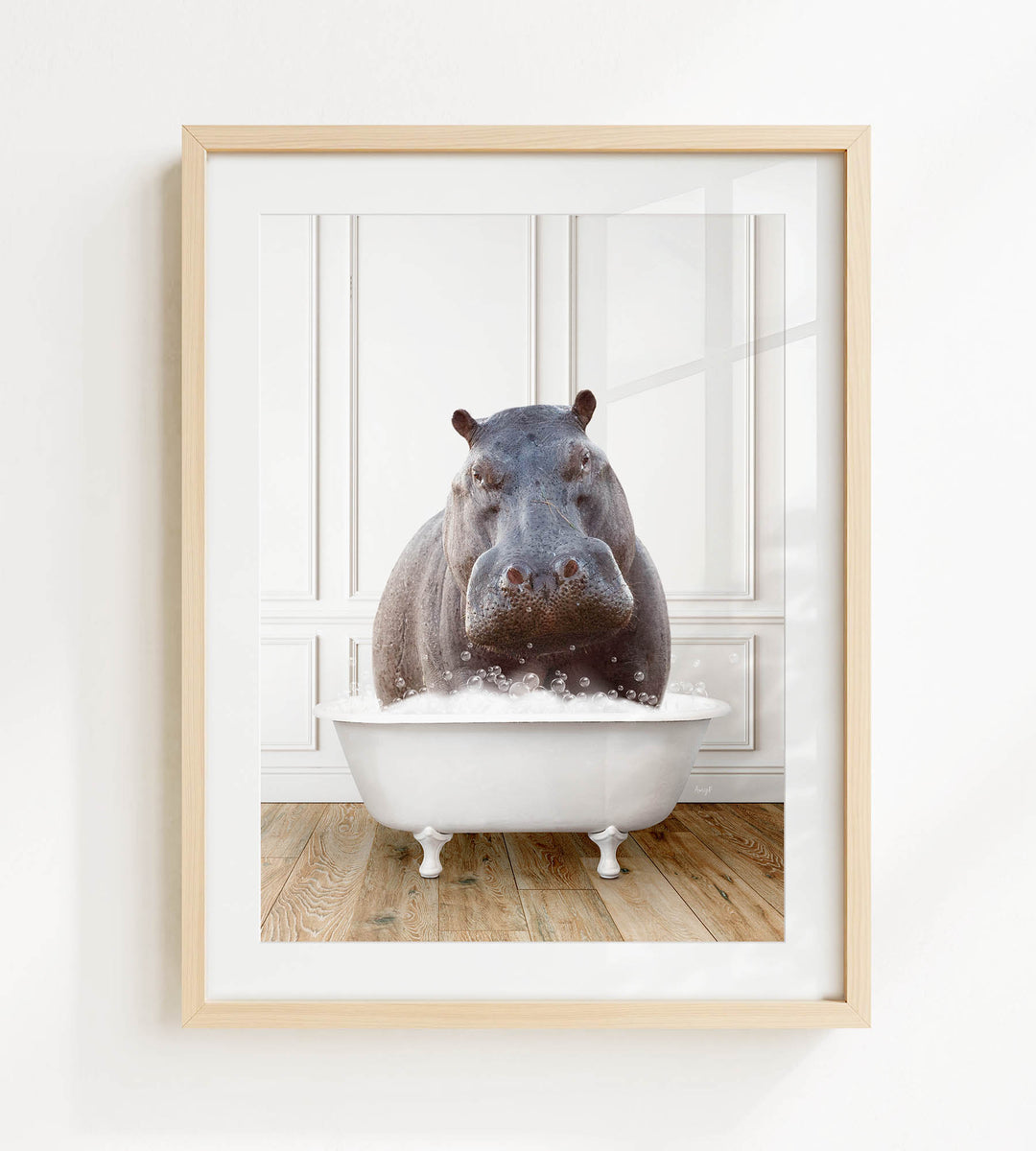 A framed image of a hippopotamus sitting in a white bathtub filled with water, creating a playful and whimsical scene.