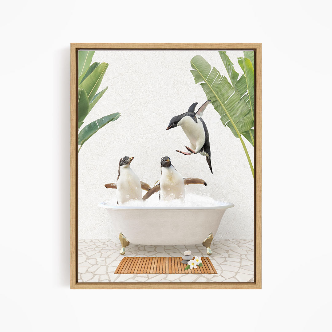 A framed image depicting three penguins sitting in a bathtub, surrounded by tropical plants and a wooden mat.