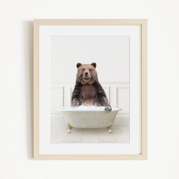 A brown bear sitting in a white bathtub filled with water, creating a whimsical and playful scene.