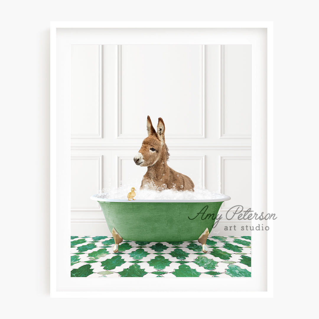 a brown dog sitting in a green bath tub