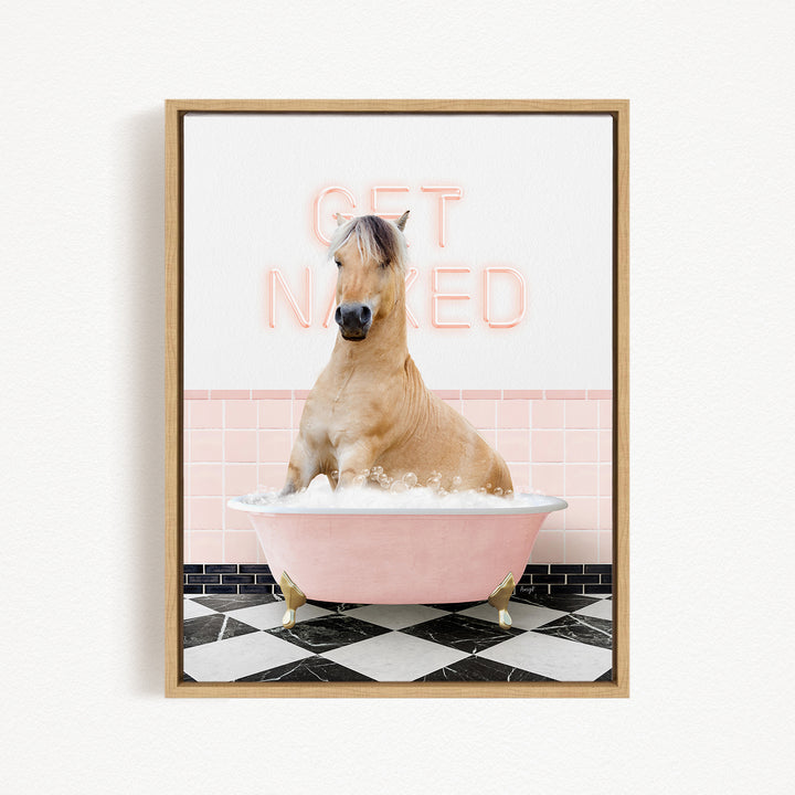 A horse sitting in a pink bathtub, with the words "GET NAKED" written on the wall behind it.