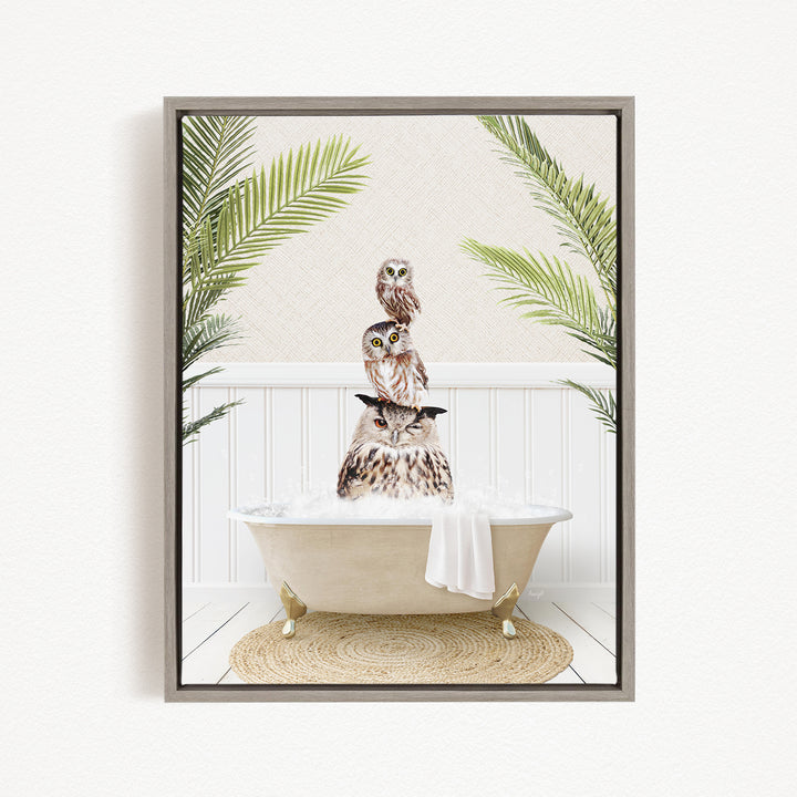 A framed image depicting three owls sitting in a bathtub, surrounded by green palm leaves.