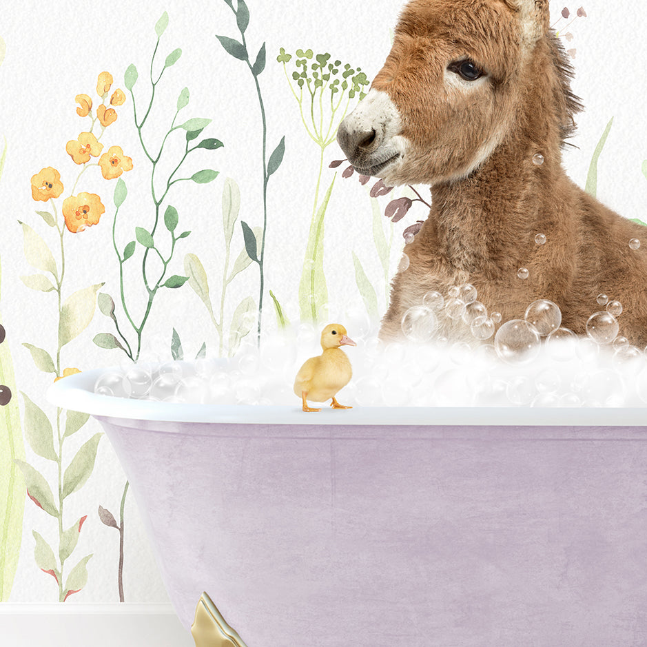 a baby donkey in a bathtub with a rubber duck