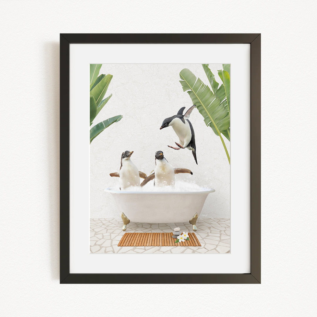 A framed image depicting three penguins sitting in a bathtub, surrounded by tropical plants and flowers.