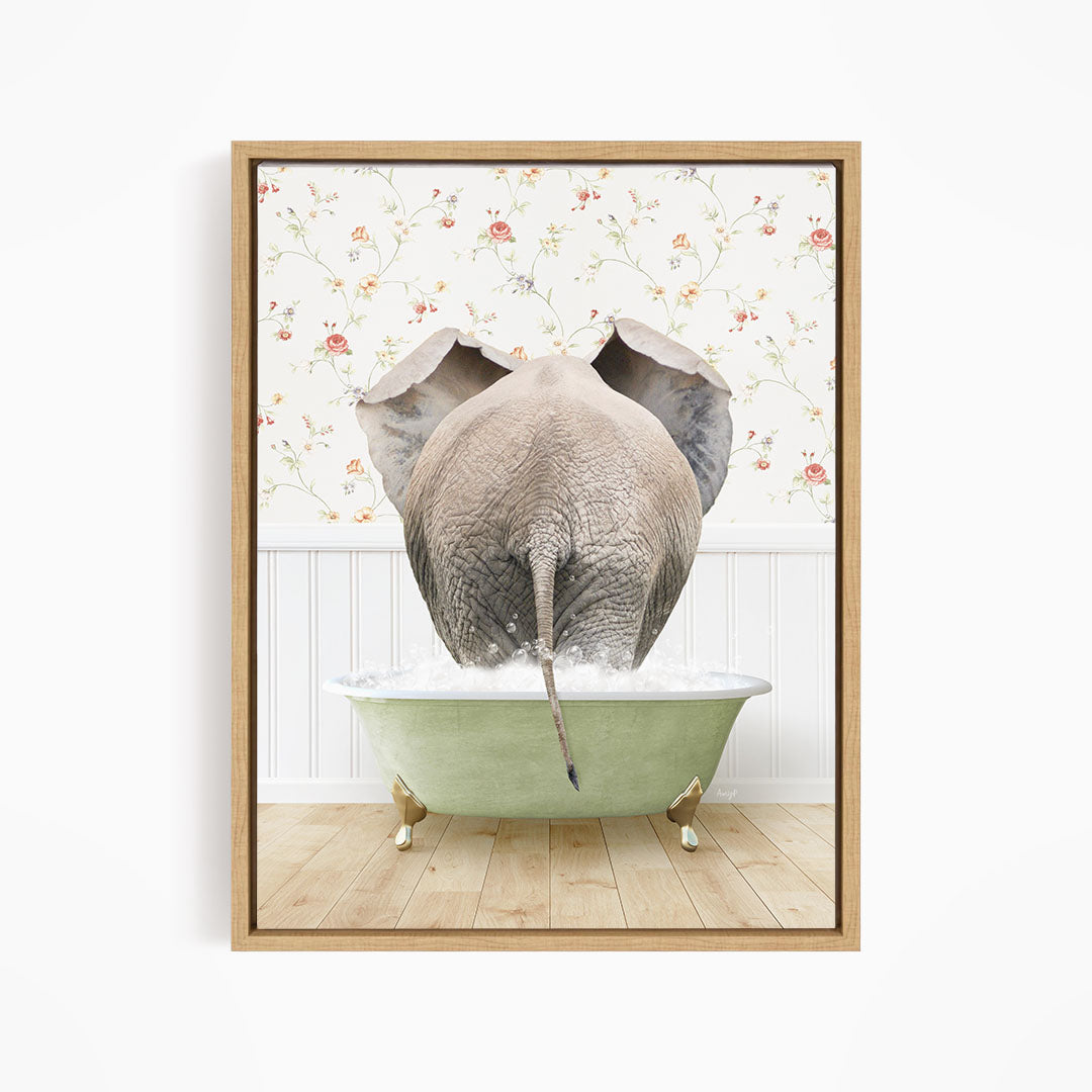 An elephant is sitting in a green bathtub filled with water, with its trunk submerged in the water.