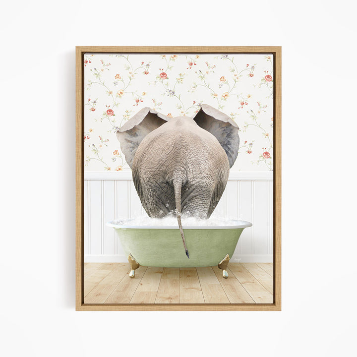An elephant is sitting in a green bathtub filled with water, with its trunk submerged in the water.