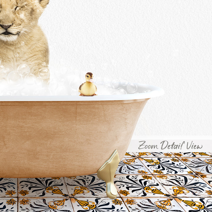 A golden bathtub filled with bubbles, with a small yellow duck sitting on the edge of the tub. The bathtub is placed on a patterned tile floor.