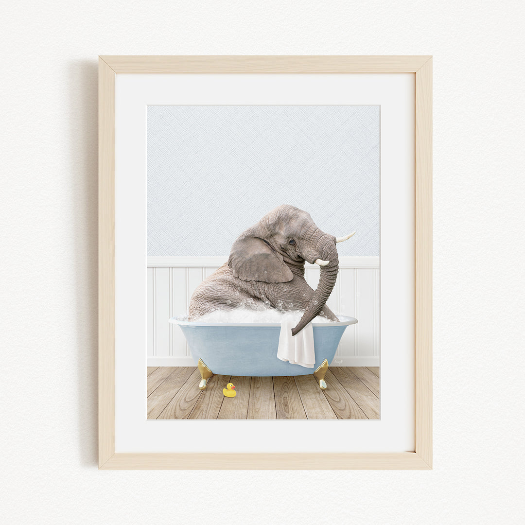 A gray elephant sitting in a blue bathtub filled with water, surrounded by yellow rubber duckies.