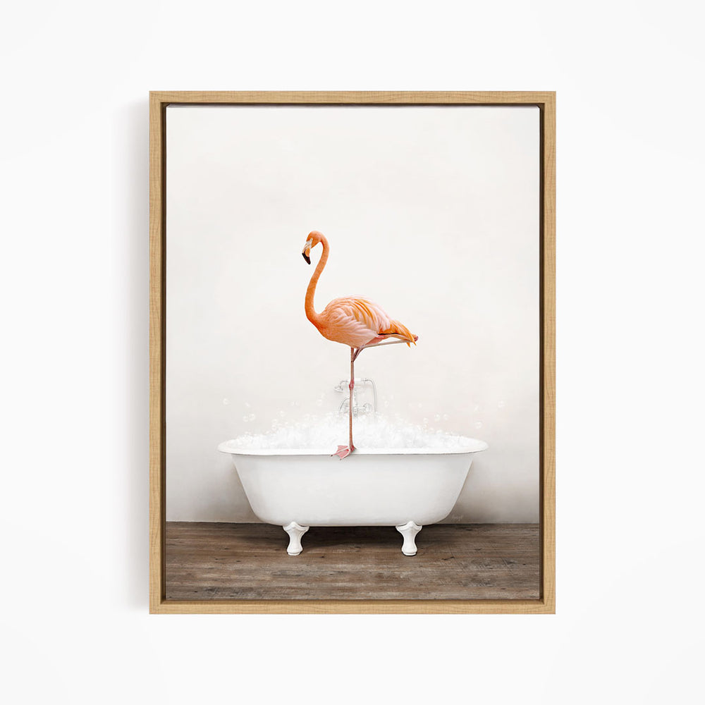 A vibrant flamingo stands on the edge of a white bathtub filled with water, creating a whimsical and playful scene.