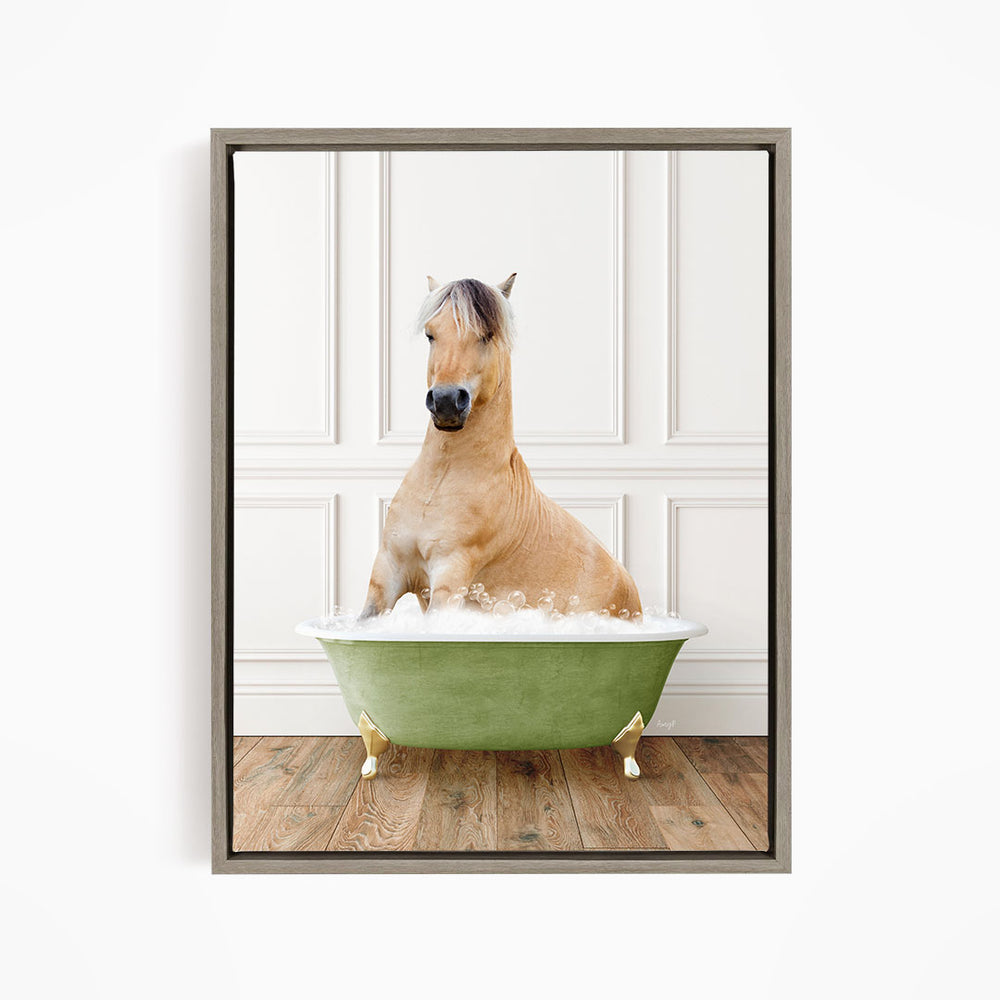 A light brown horse is sitting in a green bathtub filled with water, with its head raised and looking directly at the camera.