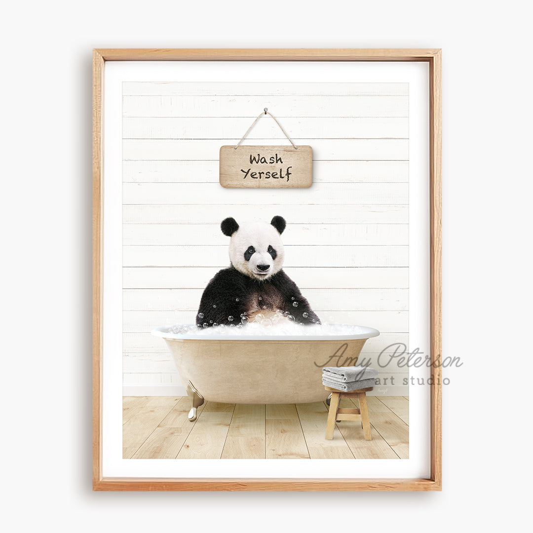 a panda bear sitting in a bathtub with a sign above it