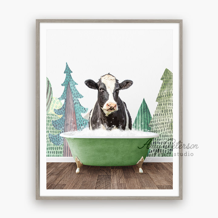 a black and white cow sitting in a green bathtub