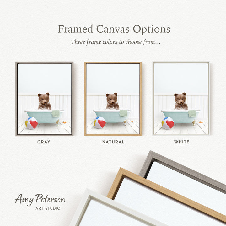 three framed canvas options, each featuring a small brown bear sitting in a bathtub with a beach ball and starfish. The options include a gray frame, a natural frame, and a white frame.