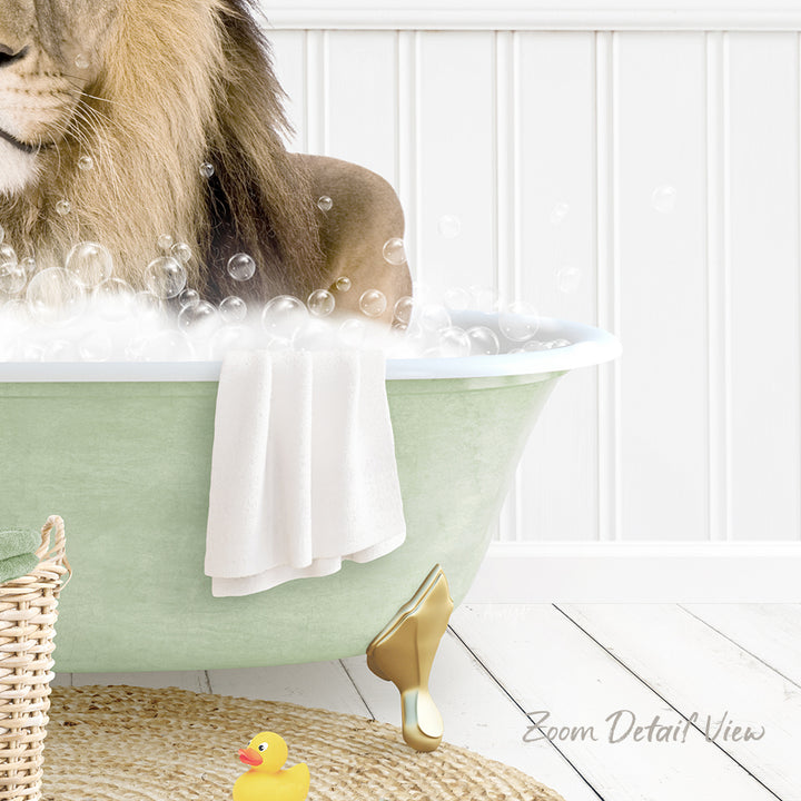 A lion is sitting in a green bathtub filled with bubbles, surrounded by a yellow rubber duck and a white towel.