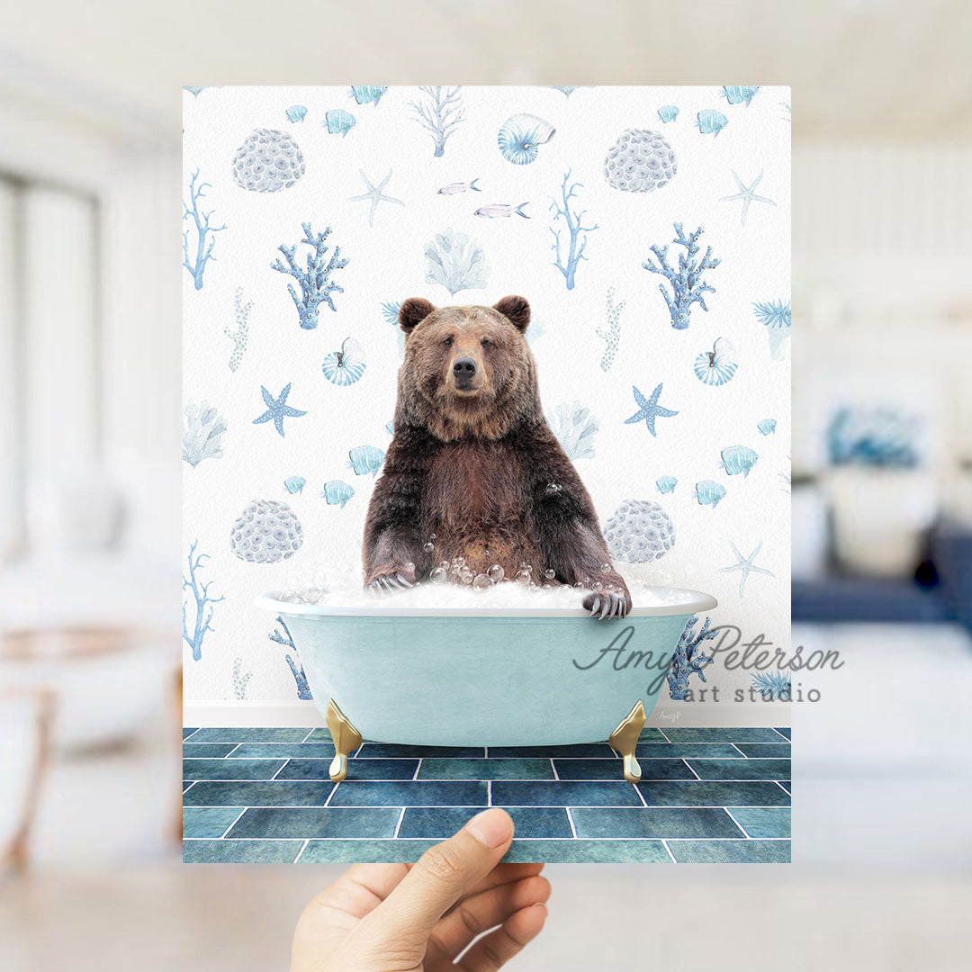 a person holding up a picture of a bear in a bathtub