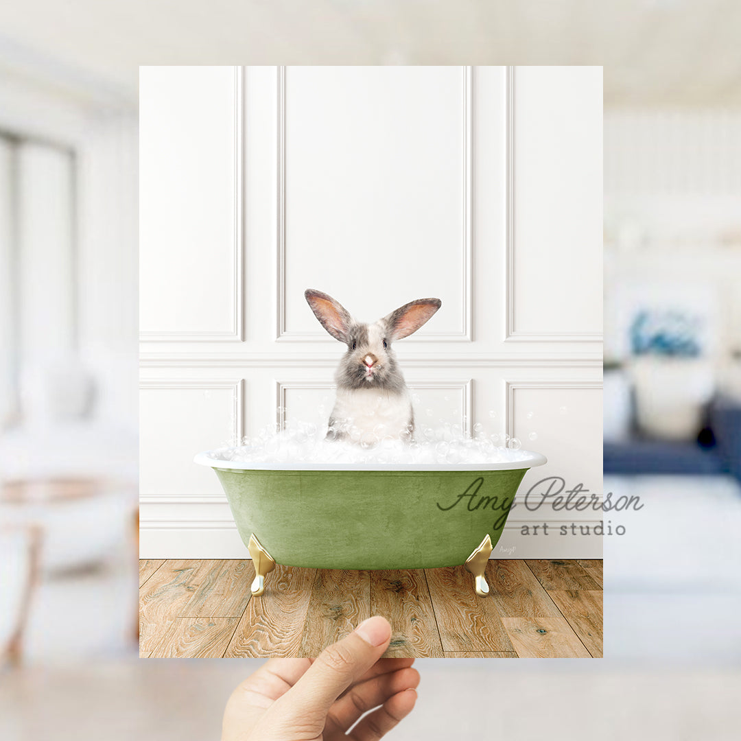 a rabbit sitting in a bathtub with foam on it