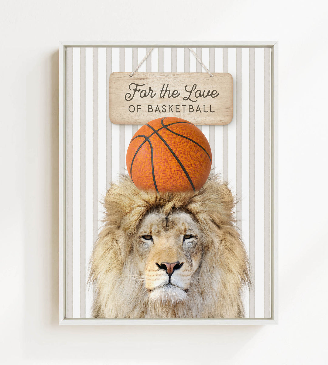 A framed image of a lion with a basketball on its head, accompanied by a wooden sign that reads "For the Love of Basketball".