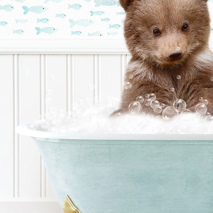 a brown bear sitting in a bath tub filled with bubbles