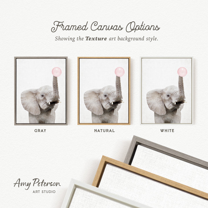 The image is a framed canvas with three different color options for a gray elephant, each with a pink bubble in its trunk. The text above the canvas options reads " Framed Canvas Options" and "Showing the Texture art background style." The text below the canvas options reads "GRY" and "NATURAL" and "WHITE" respectively. The artist's name, Amy Peterson, is also mentioned at the bottom of the image.