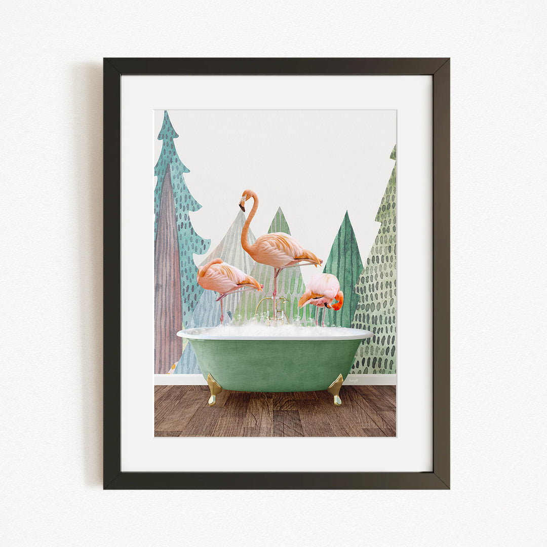 A framed image depicting three pink flamingos standing on a green bathtub, with a forest-themed background.