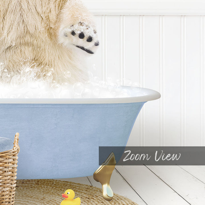 A fluffy white dog is standing in a blue bathtub filled with bubbles, with a yellow rubber duck nearby.
