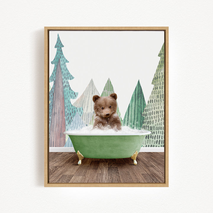 A cute brown bear is sitting in a green bathtub, surrounded by a forest scene with trees and a snowy landscape.