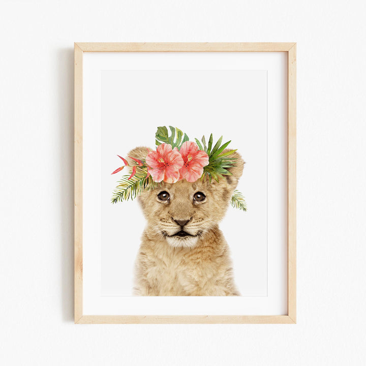 a picture of a lion cub wearing a flower crown