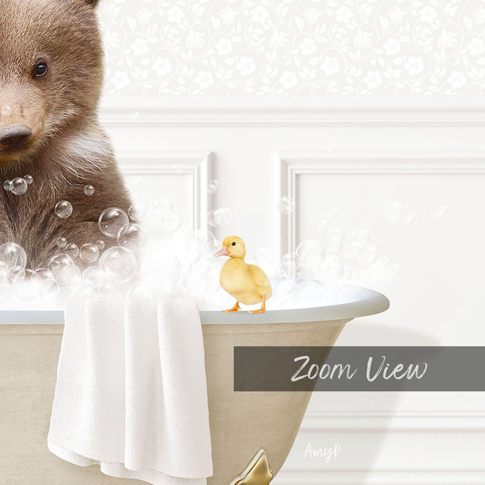 A brown bear is sitting in a bathtub filled with bubbles, with a yellow duck standing on the edge of the tub.