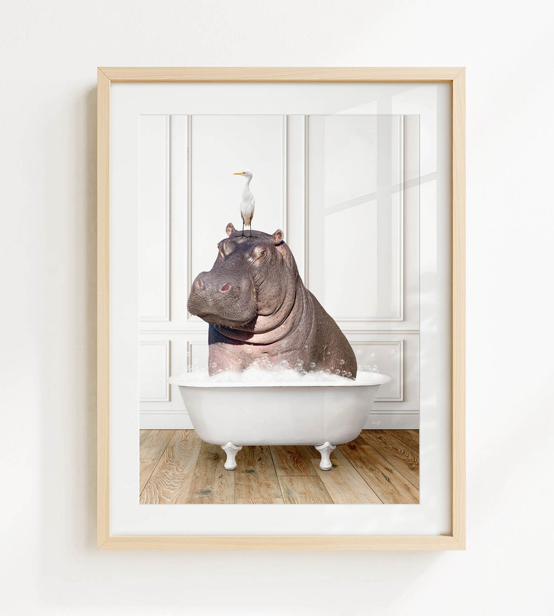 A framed image depicting a hippopotamus sitting in a bathtub, with a seagull perched on its head.