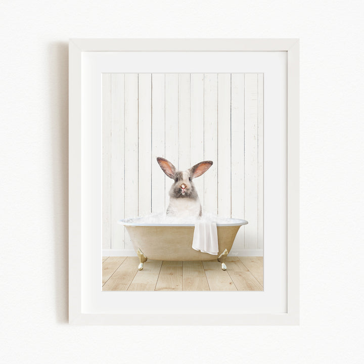 A white rabbit sitting in a bathtub filled with water, with its head poking out of the tub.