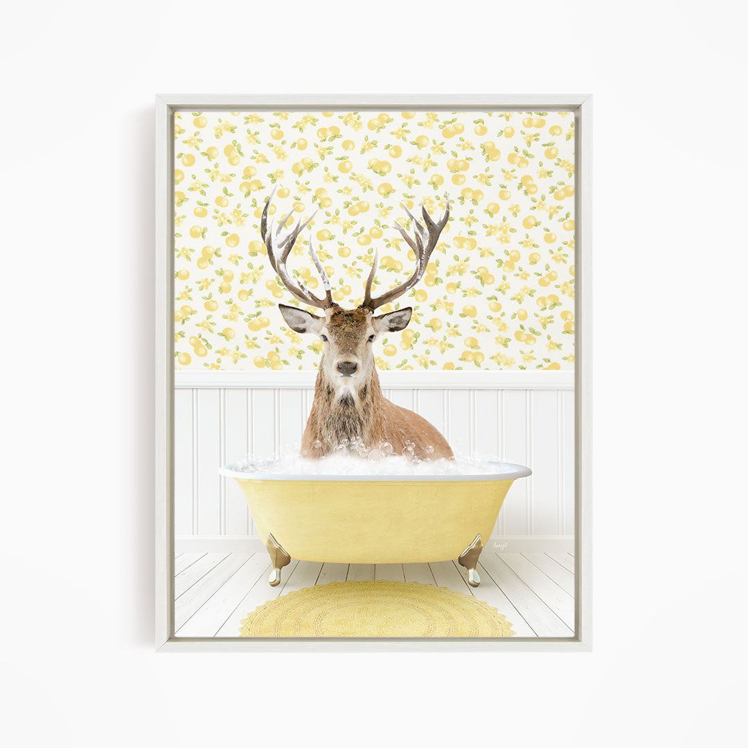A deer with antlers is sitting in a yellow bathtub filled with water, surrounded by a yellow floral wallpaper.
