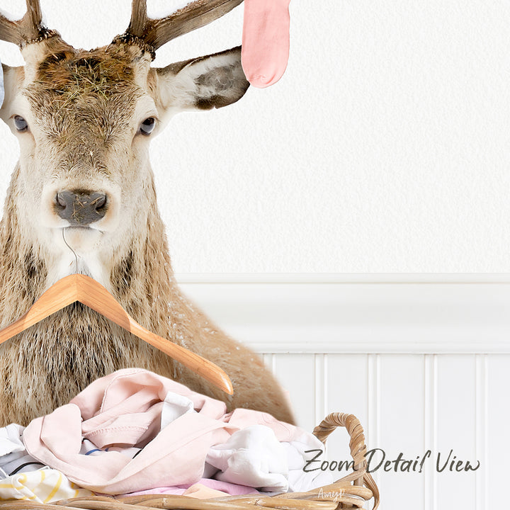 A deer head mounted on a wooden hanger, with clothes hanging in a basket below it.