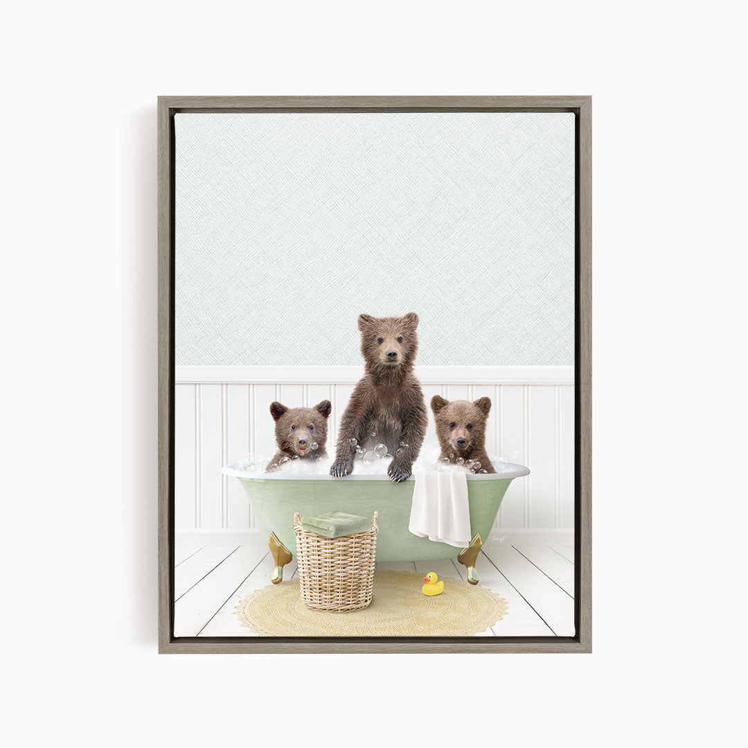 A framed image depicting three bears sitting in a green bathtub, with one bear sitting in the center and the other two bears sitting on either side.