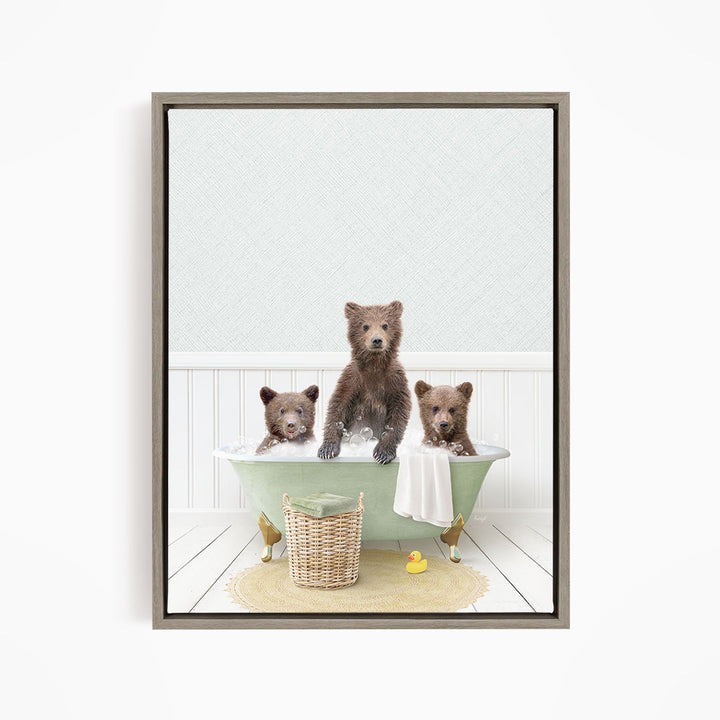 A framed image depicting three bears sitting in a green bathtub, with one bear sitting in the center and the other two bears sitting on either side.