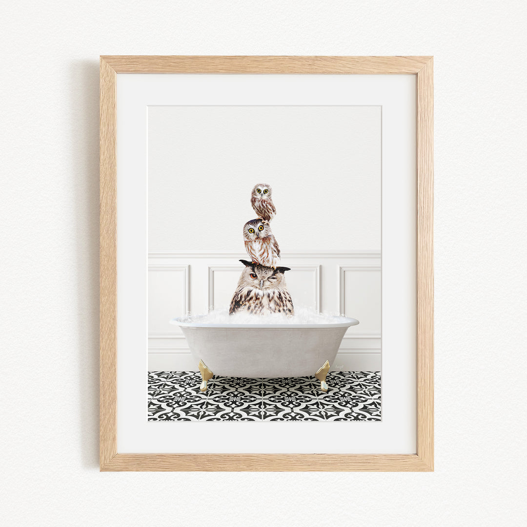 A framed image depicting a white bathtub filled with water, with a bird perched on top of the tub.
