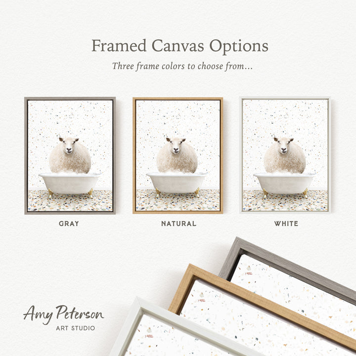 The image is a framed canvas option showcasing three different frame colors: gray, natural, and white. The canvas features a sheep sitting in a tub, and the frame colors are gray, natural, and white.
