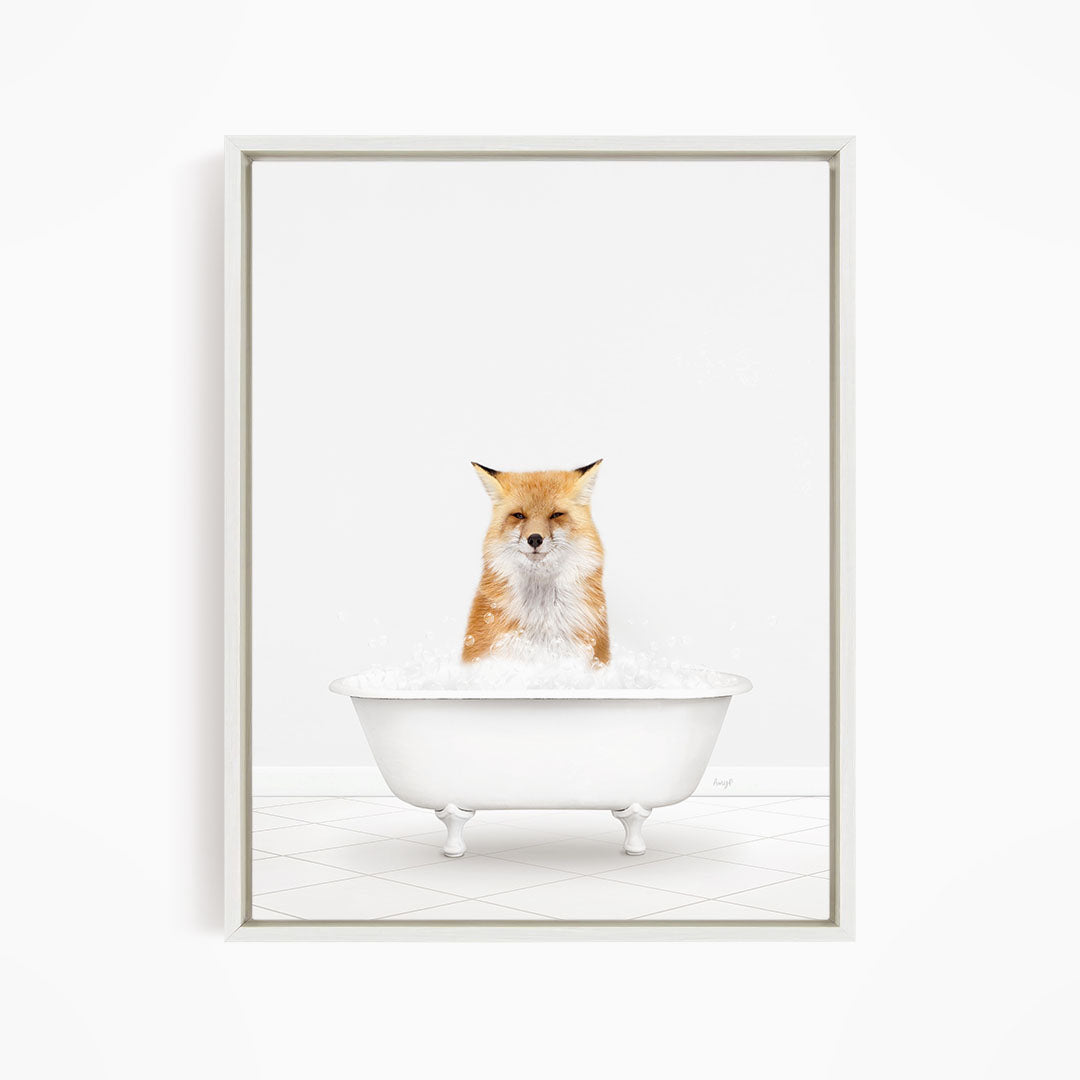 A red fox sitting in a white bathtub filled with water.