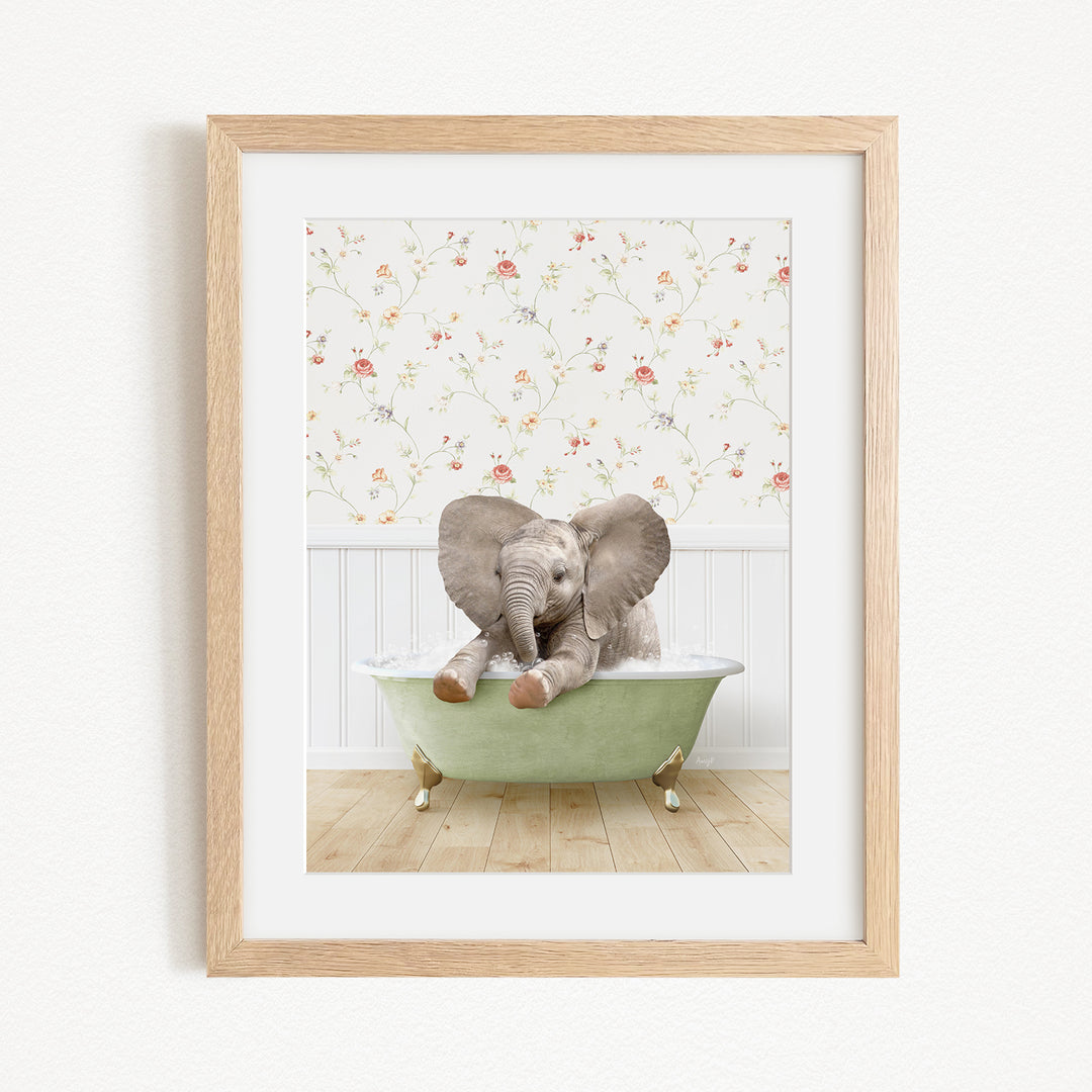 A baby elephant sitting in a green bathtub, surrounded by a floral wallpaper.