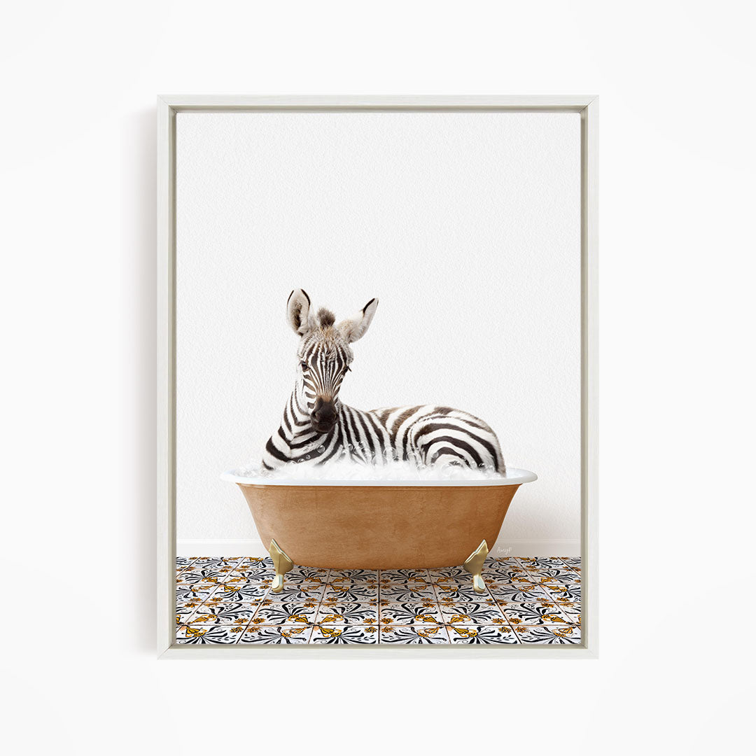 A zebra is sitting in a bathtub filled with water, surrounded by a patterned tile floor.