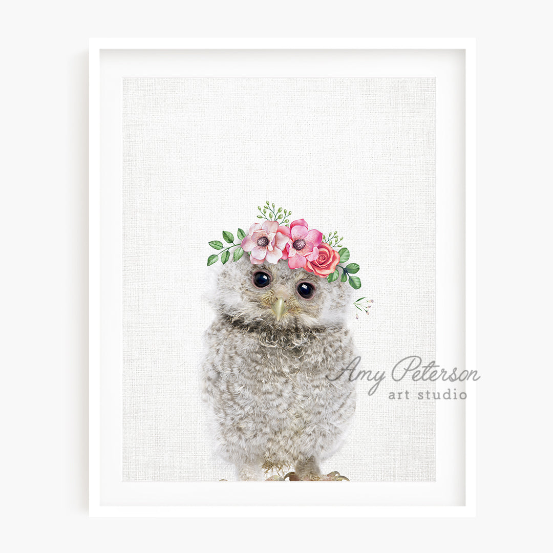 a picture of an owl wearing a flower crown