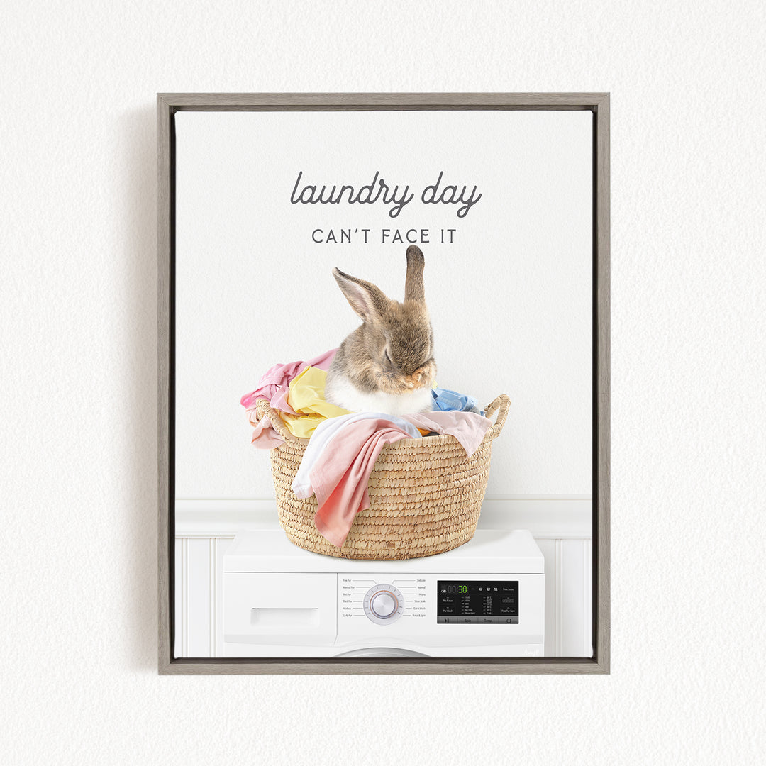 A rabbit sitting in a woven laundry basket, with the text "laundry day can't face it" above the basket.