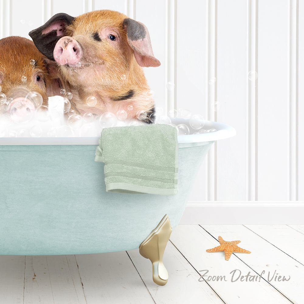 A pair of adorable pigs enjoying a bath in a light blue bathtub, surrounded by bubbles and a green towel.