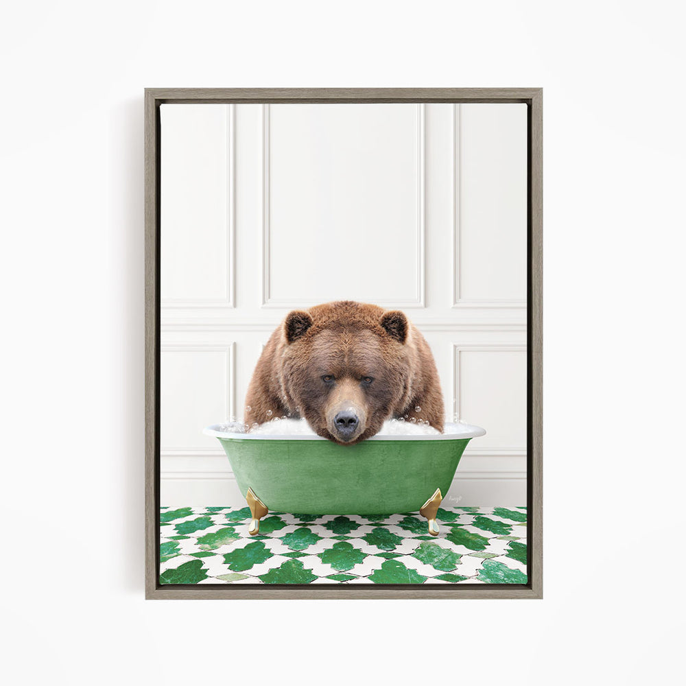 A brown bear is sitting in a green bathtub filled with water, appearing to be enjoying a bath.