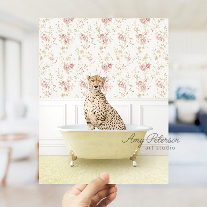 a hand holding a card with a cheetah sitting in a bathtub