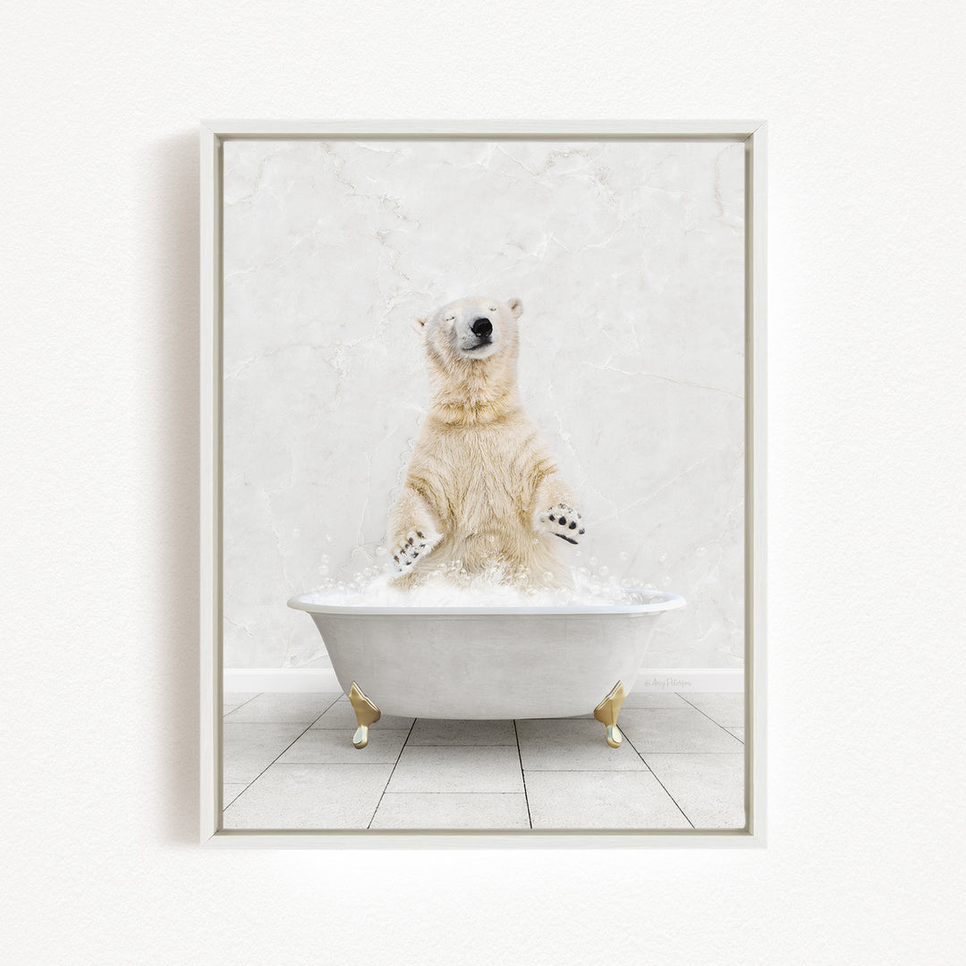 A polar bear sitting in a white bathtub filled with water, appearing to be enjoying a bath.