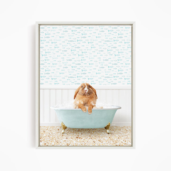 A brown rabbit sitting in a light blue bathtub filled with water, surrounded by a pattern of small fish.