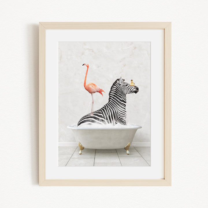 A framed image depicting a zebra sitting in a bathtub, with a flamingo standing on its back and a bird perched on its head.