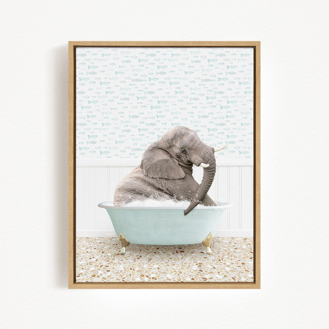 A gray elephant is sitting in a light blue bathtub, surrounded by a patterned tile floor and a white wall with a fish-themed wallpaper.