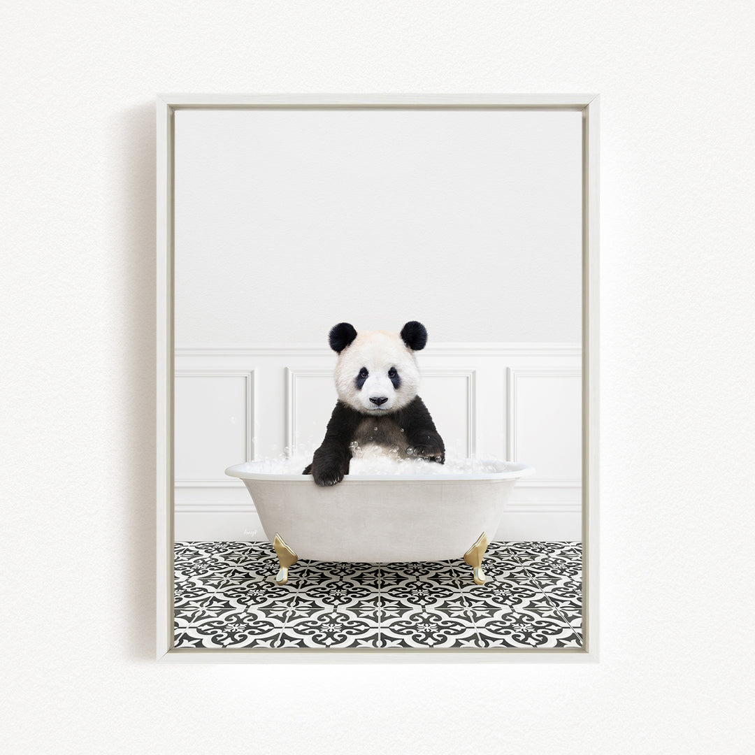 A panda bear sitting in a white bathtub filled with bubbles, surrounded by a black and white patterned floor.