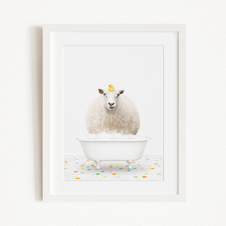 A white sheep with a yellow duck perched on its head is sitting in a white bathtub filled with bubbles, creating a whimsical and playful scene.